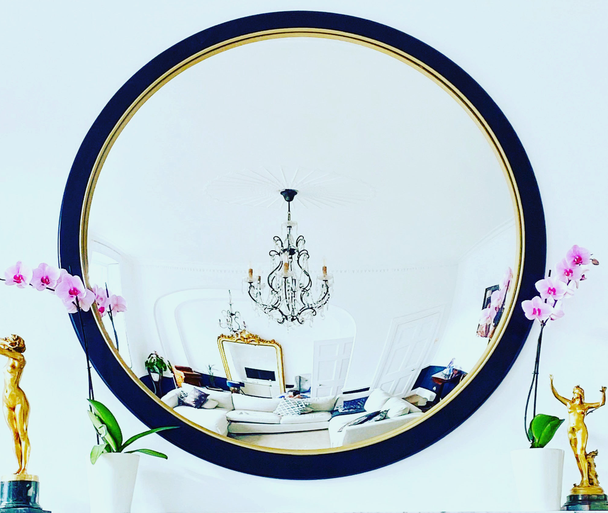 A detailed image of a unique convex mirror showcasing artistic patterns and a luxurious frame, enhancing any space.