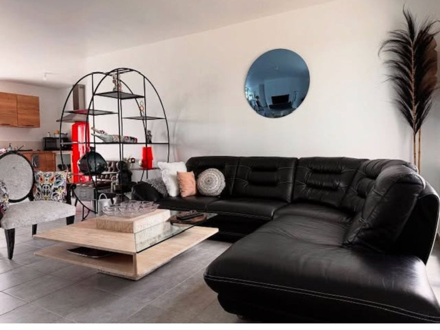 Decorative mirror enhancing light and space in modern interior design
