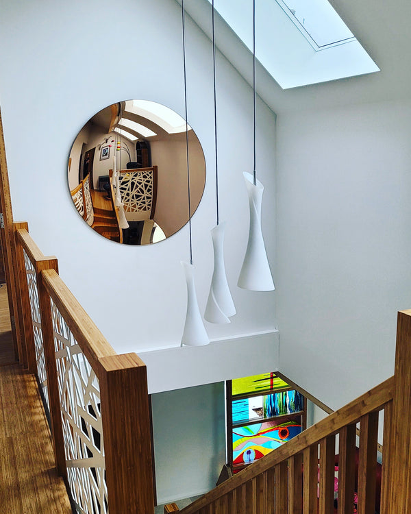 A photograph displaying a convex mirror in an indoor setting, accentuating its design and functionality.